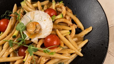 Homemade pljukanci pasta with seafood